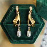 Pearl Earrings with Elegant Hand