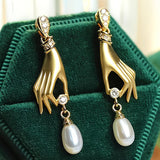 Pearl Earrings with Elegant Hand